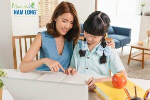 Homeschool Asian little young girl student learning sitting on t